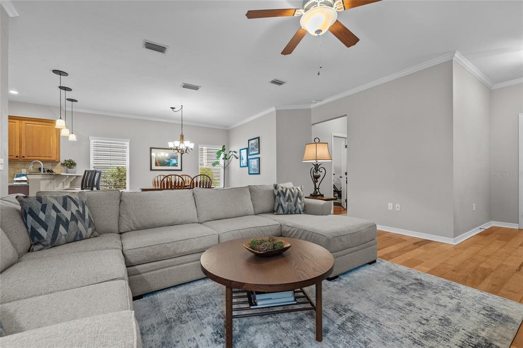 8251 Southwest 78th Lane Gainesville, FL 32608 - Photo 24 of 29 a living room with furniture and a chandelier
