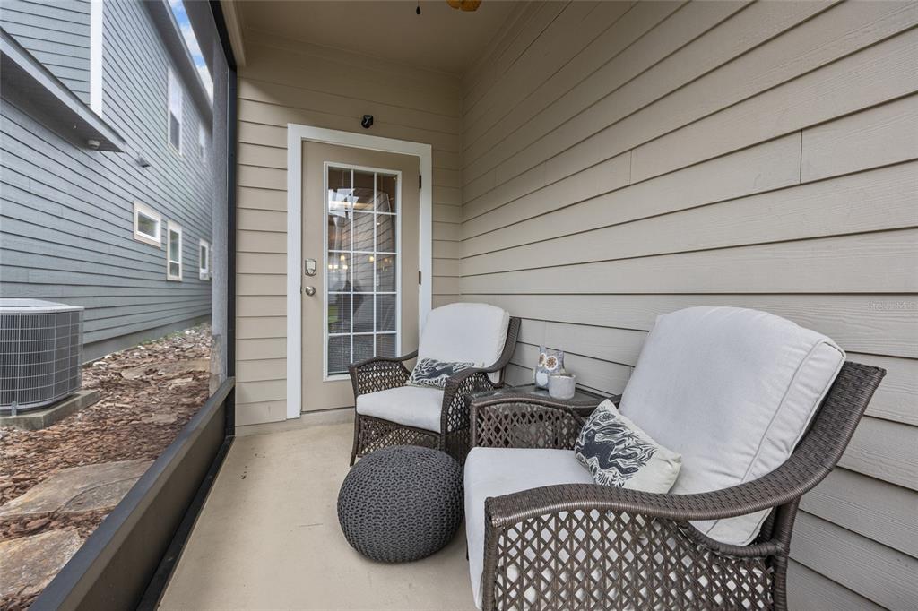 8251 Southwest 78th Lane Gainesville, FL 32608 - Photo 25 of 29 a balcony view with a couch and table