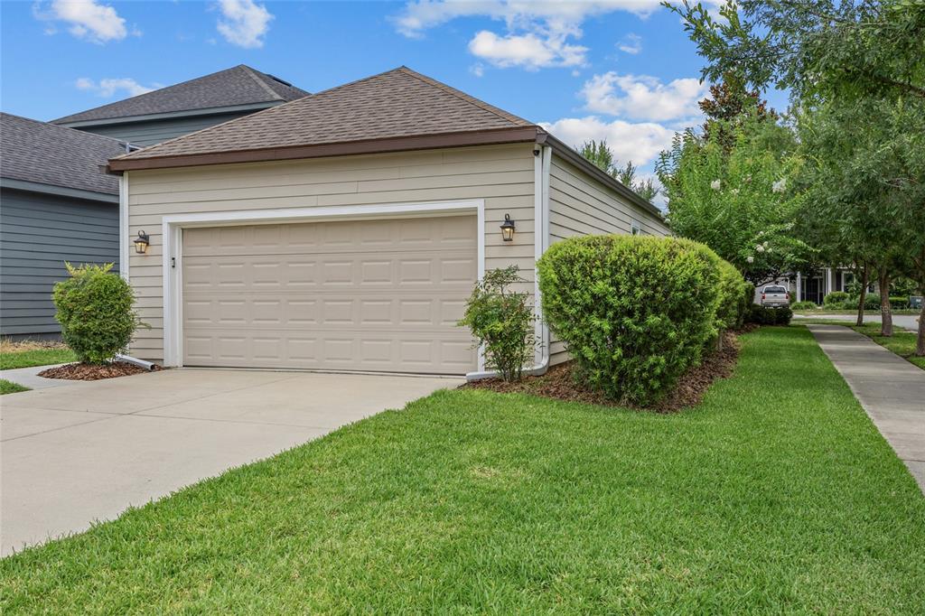 8251 Southwest 78th Lane Gainesville, FL 32608 - Photo 5 of 29 a front view of a house with garden