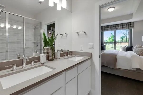 a bathroom with a double vanity sink and a mirror