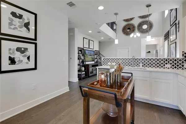 a view of a livingroom with furniture and a large window