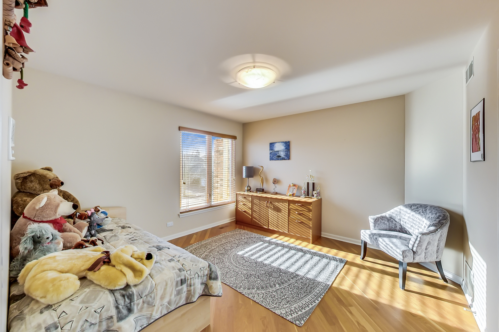 791 Endicott Road Highwood, IL 60040 - Photo 17 of 25 a bedroom with a bed and wooden floor