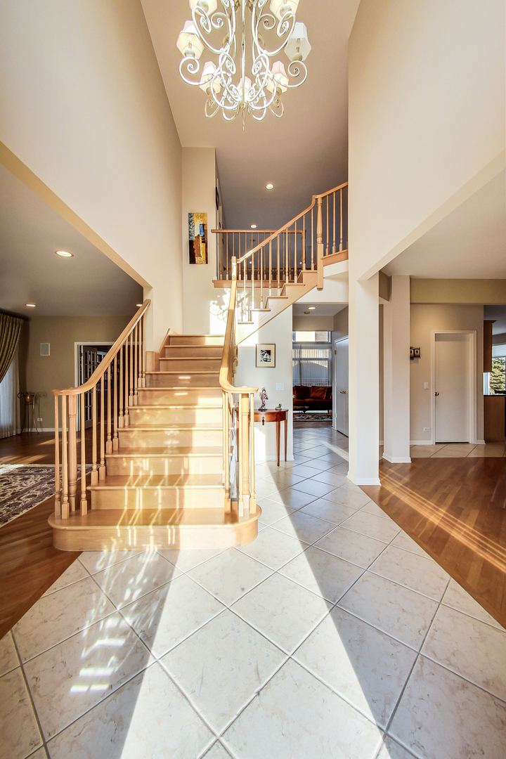 791 Endicott Road Highwood, IL 60040 - Photo 2 of 25 a lobby with furniture and a chandelier