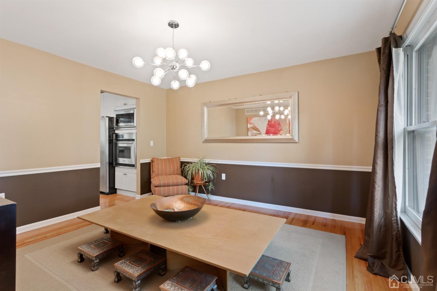3 Rider Place West Windsor, NJ 08550 - Photo 13 of 33 a view of a dining room with furniture and a chandelier