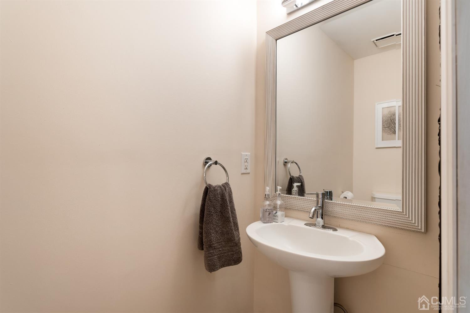 3 Rider Place West Windsor, NJ 08550 - Photo 15 of 33 a bathroom with a sink and a mirror