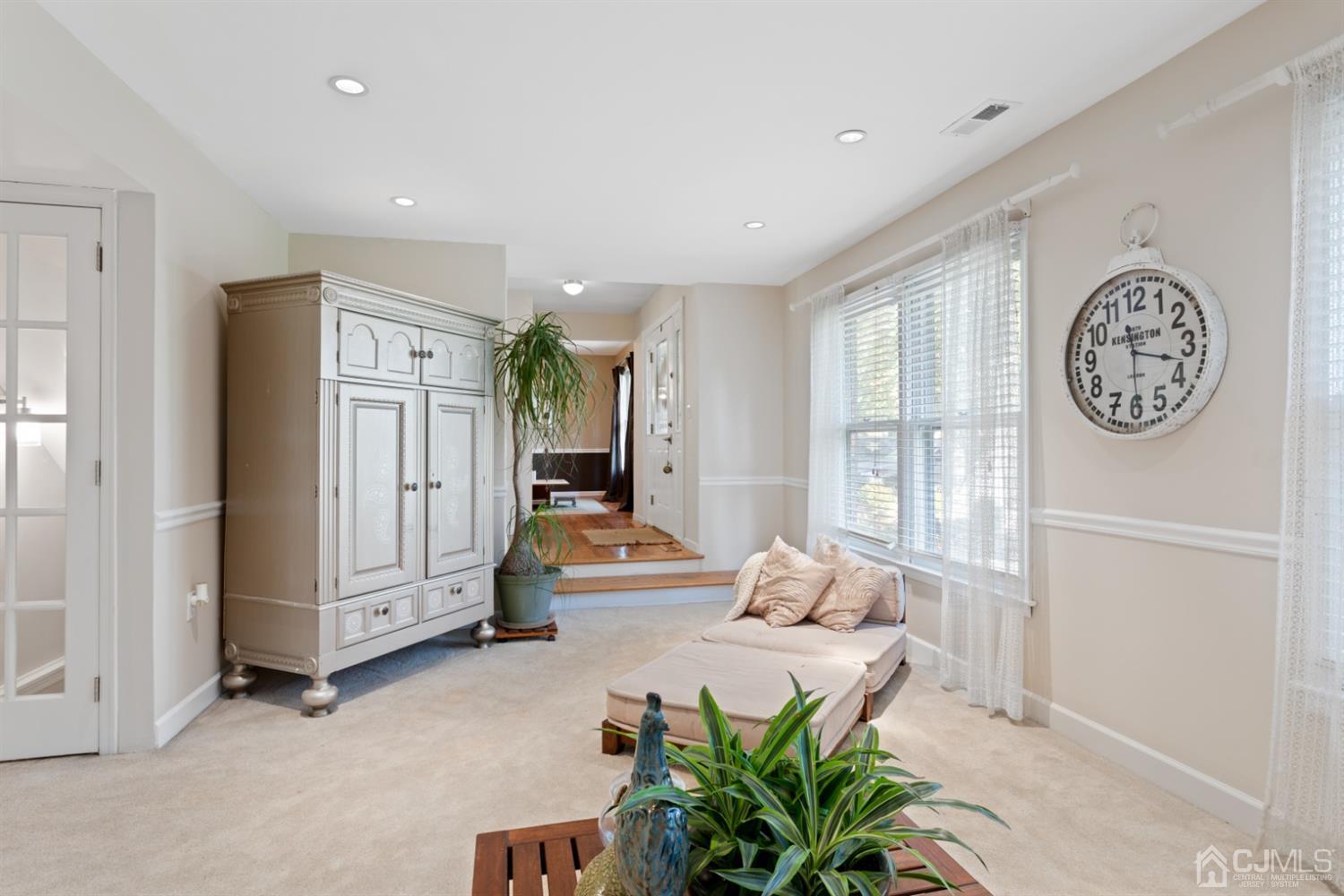 3 Rider Place West Windsor, NJ 08550 - Photo 5 of 33 a hallway with a large mirror and a window