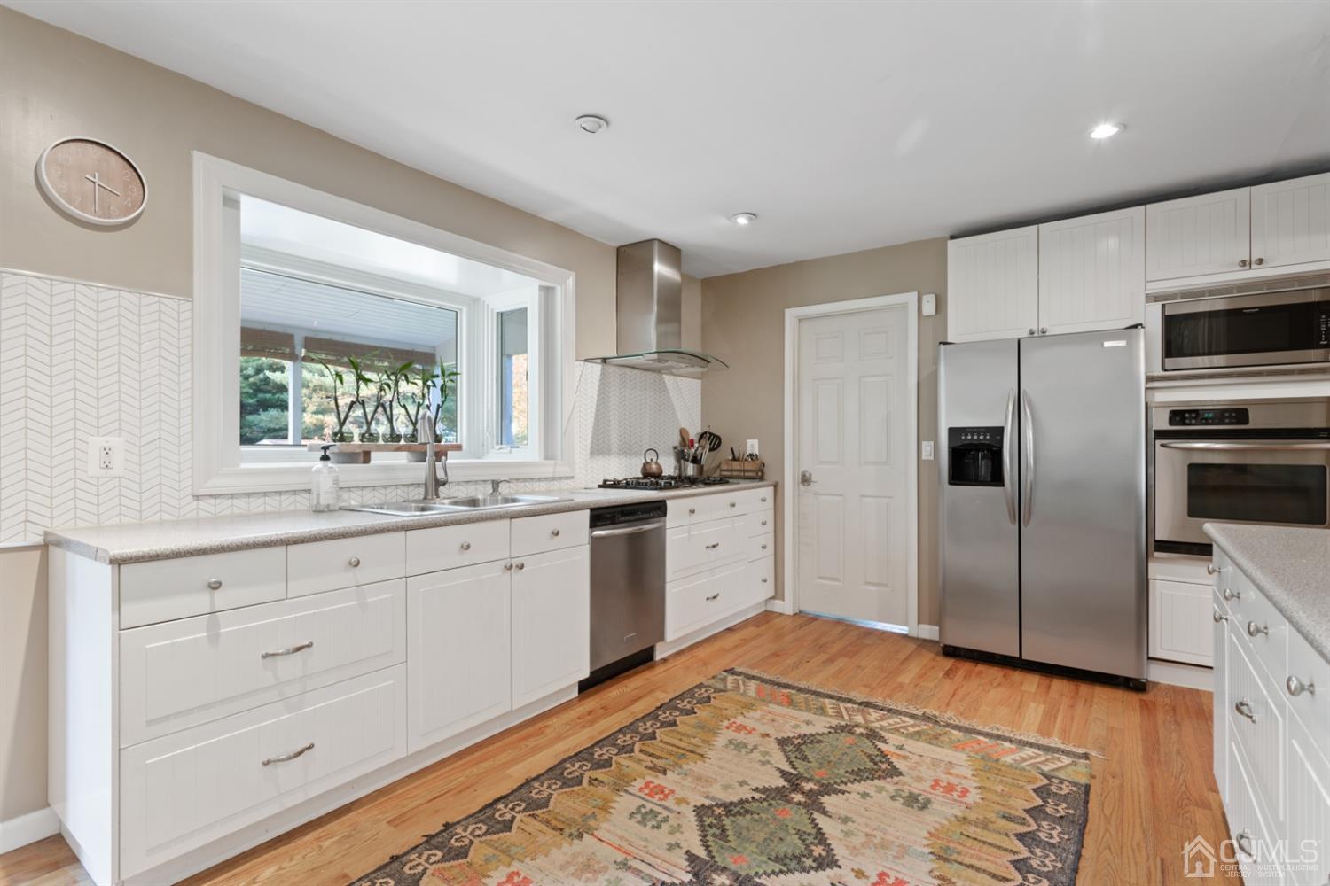 3 Rider Place West Windsor, NJ 08550 - Photo 10 of 33 a kitchen with granite countertop cabinets stainless steel appliances and a window