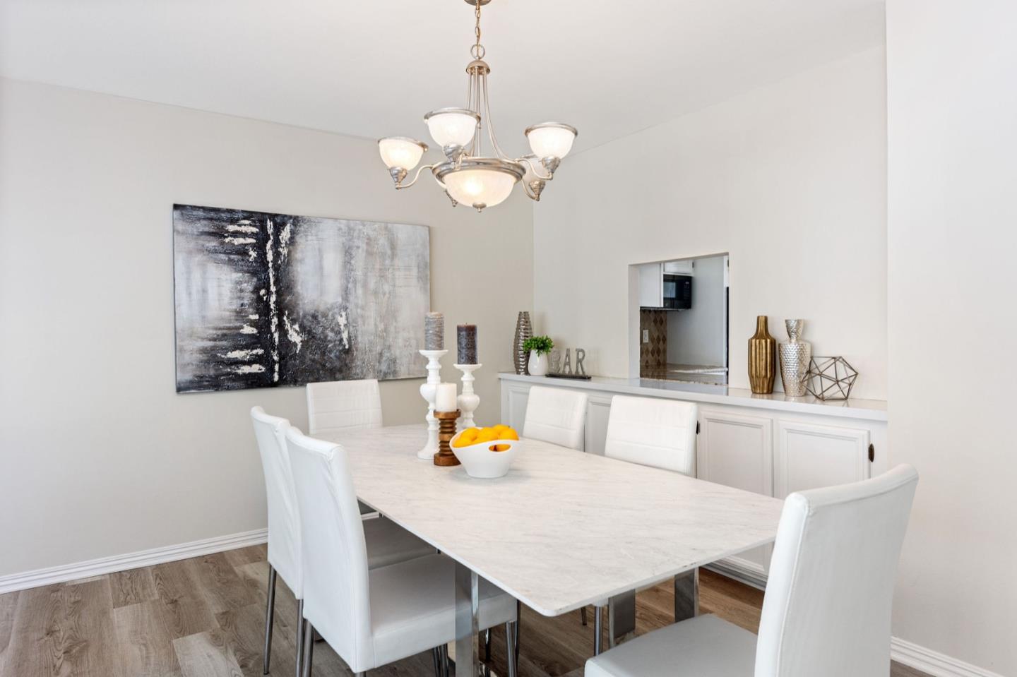 1063 Glacier Avenue Pacifica, CA 94044 - Photo 20 of 63 a view of a dining room with furniture and wooden floor