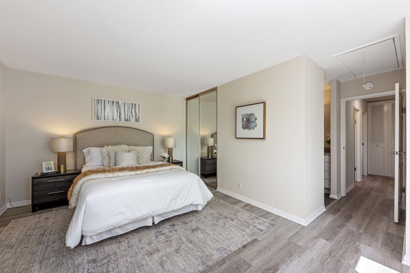 1063 Glacier Avenue Pacifica, CA 94044 - Photo 22 of 63 a bedroom with a bed and a night stand