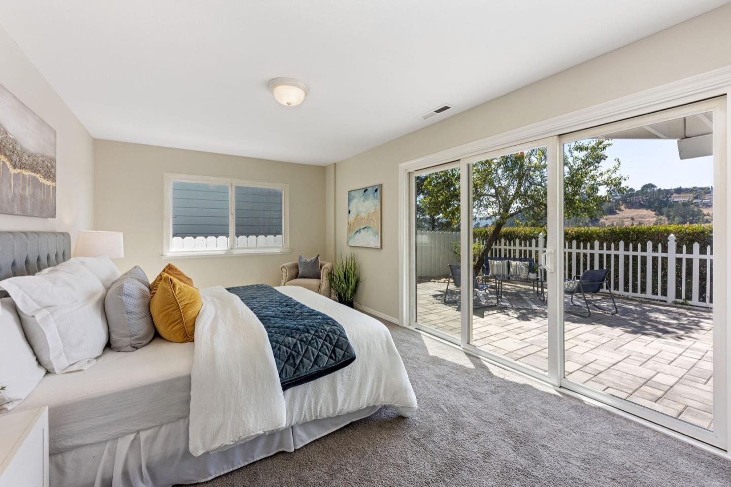 1063 Glacier Avenue Pacifica, CA 94044 - Photo 28 of 63 a bedroom with a bed and glass door