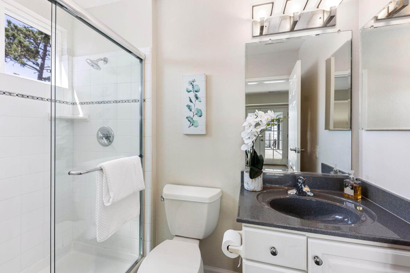 1063 Glacier Avenue Pacifica, CA 94044 - Photo 31 of 63 a bathroom with a sink toilet and shower