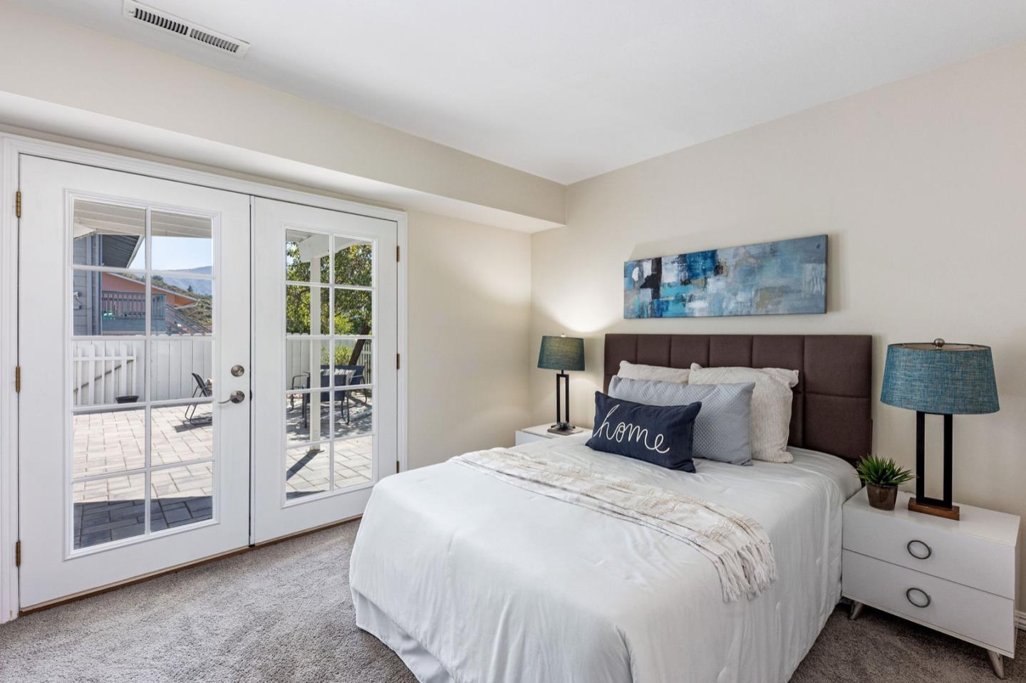 1063 Glacier Avenue Pacifica, CA 94044 - Photo 33 of 63 a bedroom with a large bed and a window