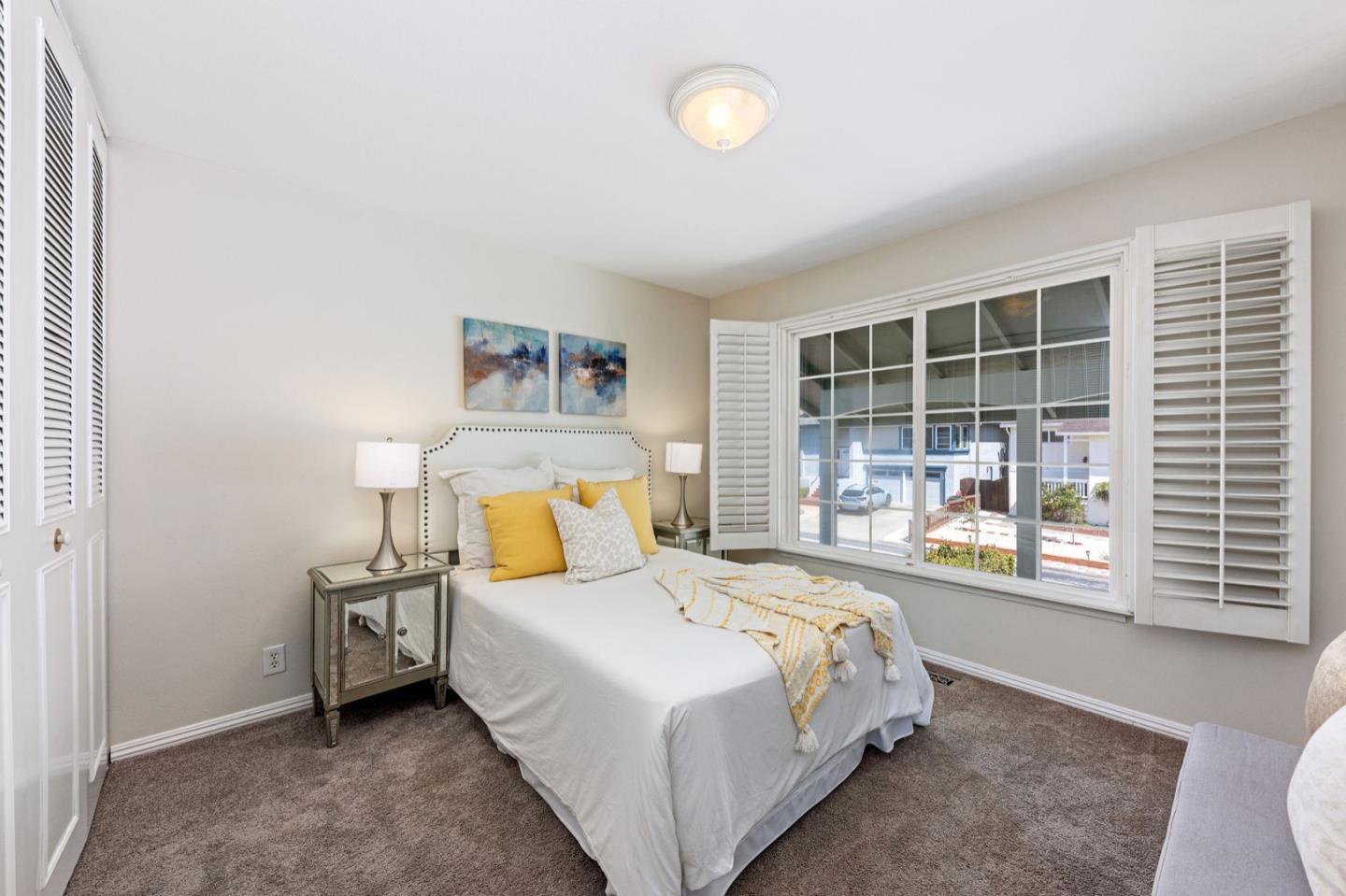 1063 Glacier Avenue Pacifica, CA 94044 - Photo 35 of 63 a bed room with a bed and a large window