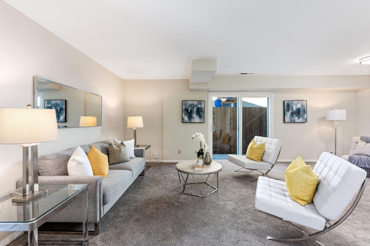 1063 Glacier Avenue Pacifica, CA 94044 - Photo 39 of 63 a living room with furniture and lamp