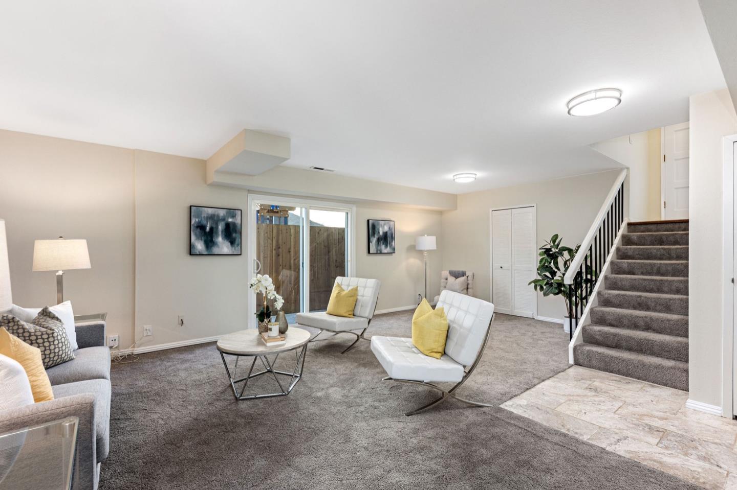1063 Glacier Avenue Pacifica, CA 94044 - Photo 40 of 63 a living room with furniture and wooden floor