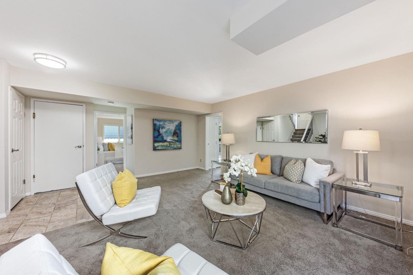 1063 Glacier Avenue Pacifica, CA 94044 - Photo 42 of 63 a living room with furniture and a lamp