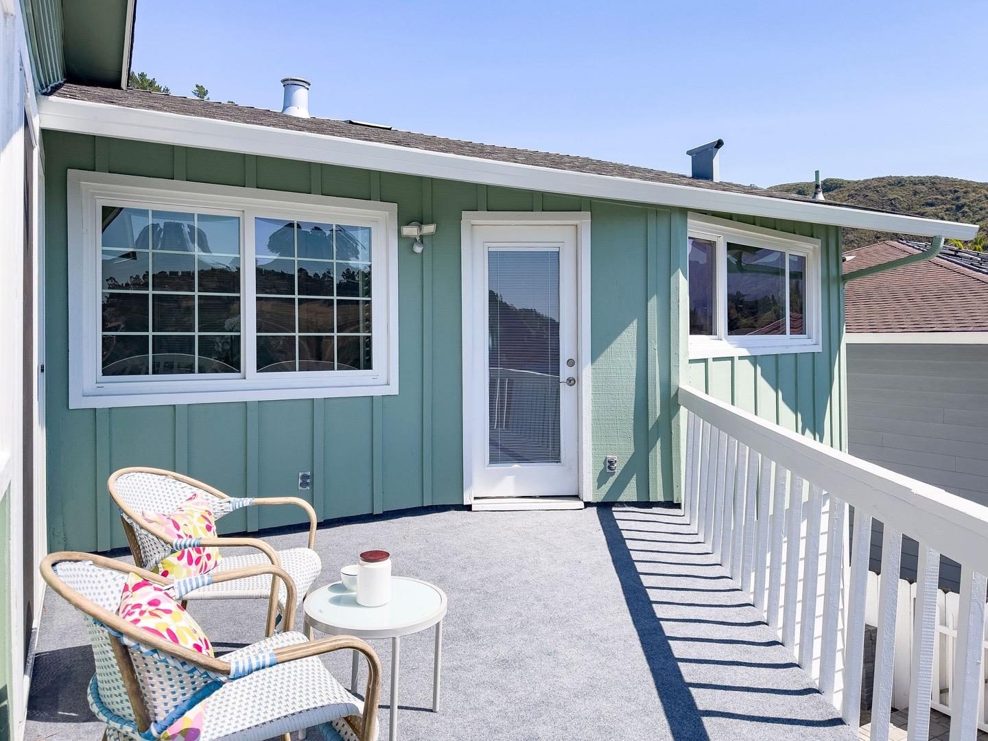 1063 Glacier Avenue Pacifica, CA 94044 - Photo 45 of 63 a backyard of a house with table and chairs