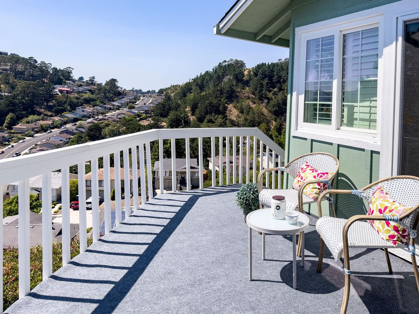 1063 Glacier Avenue Pacifica, CA 94044 - Photo 48 of 63 a view of a chair and tables in the balcony
