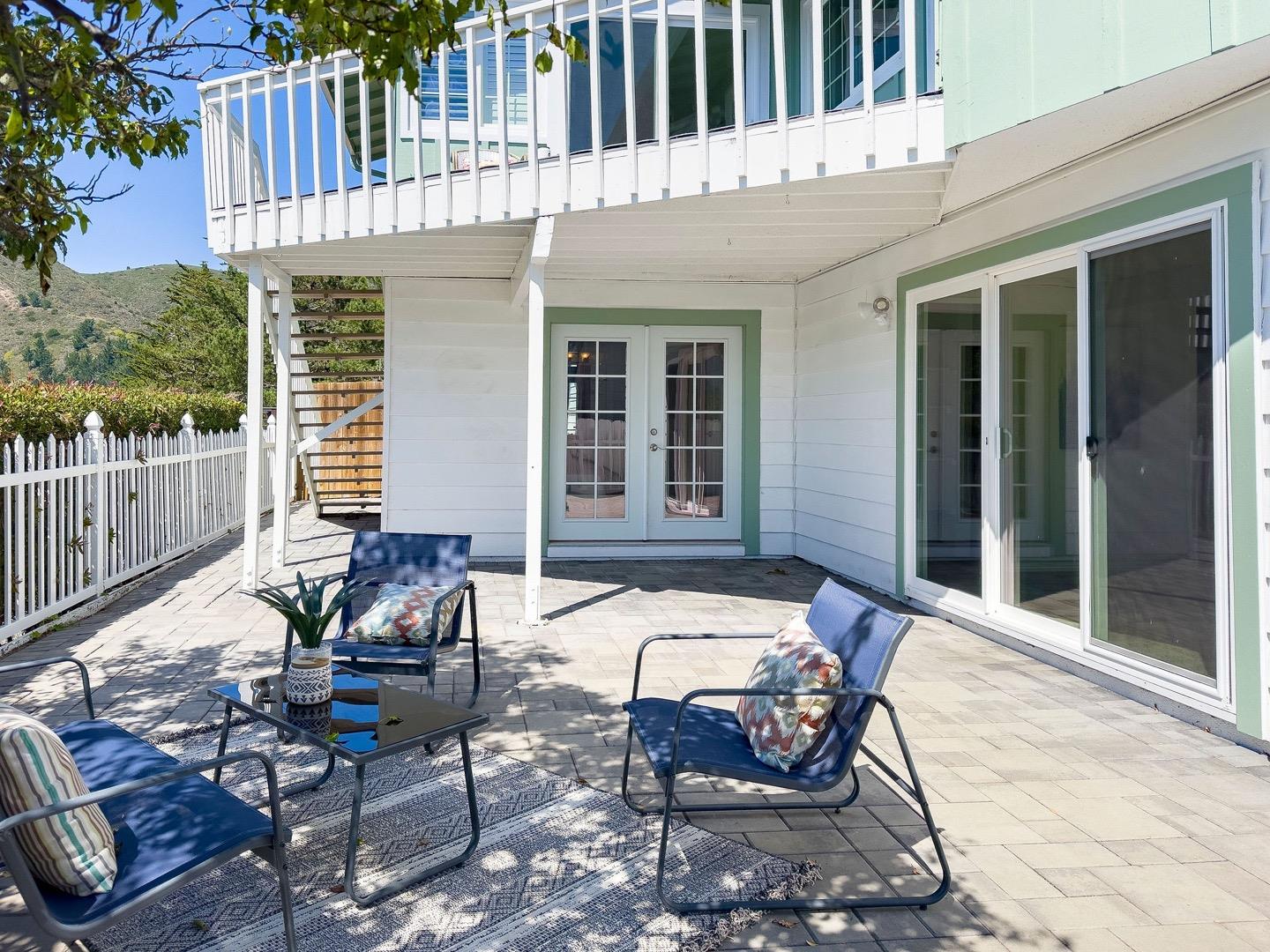 1063 Glacier Avenue Pacifica, CA 94044 - Photo 51 of 63 a view of a house with backyard sitting area and garden