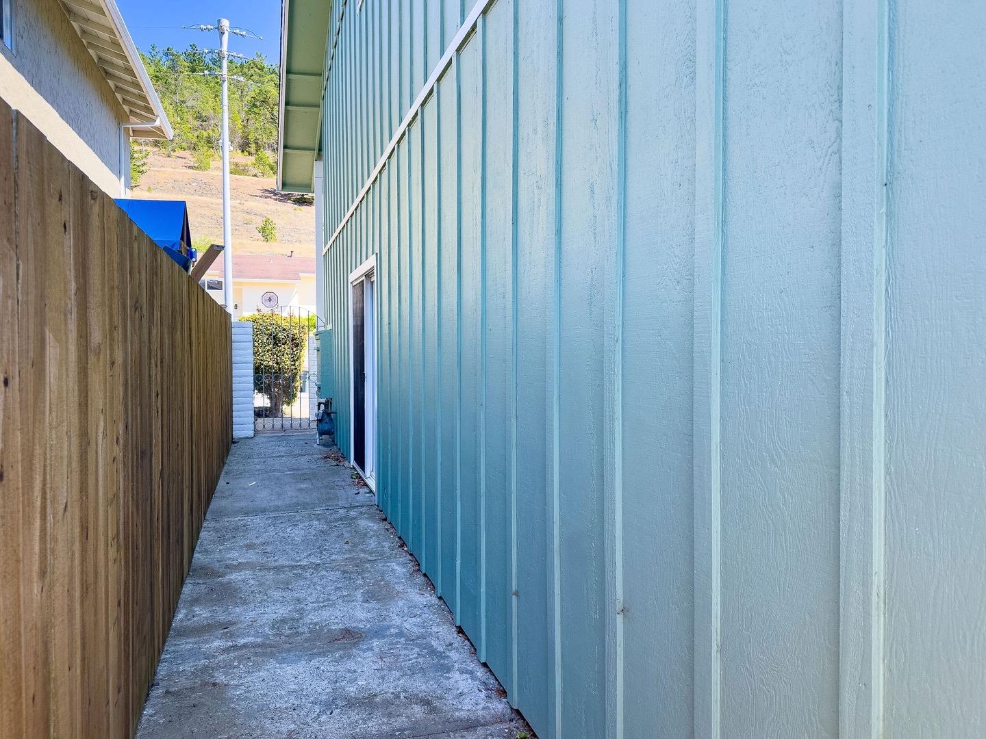 1063 Glacier Avenue Pacifica, CA 94044 - Photo 57 of 63 a view of a wooden door with a stairs