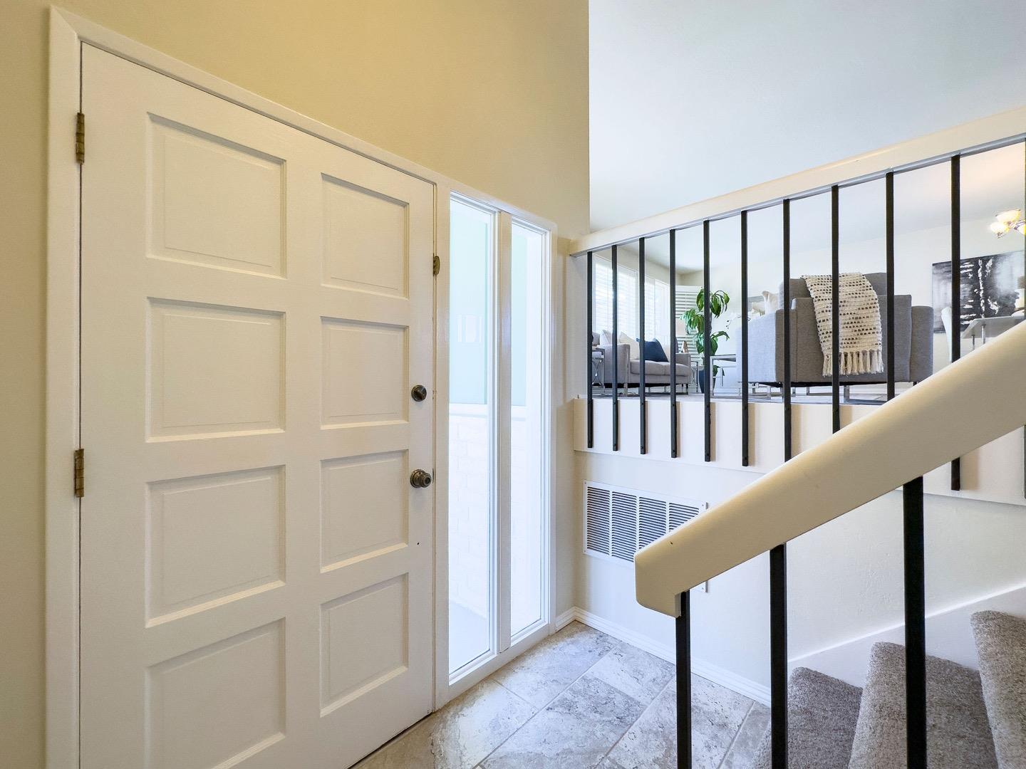 1063 Glacier Avenue Pacifica, CA 94044 - Photo 7 of 63 a view of a hallway with wooden floor and staircase