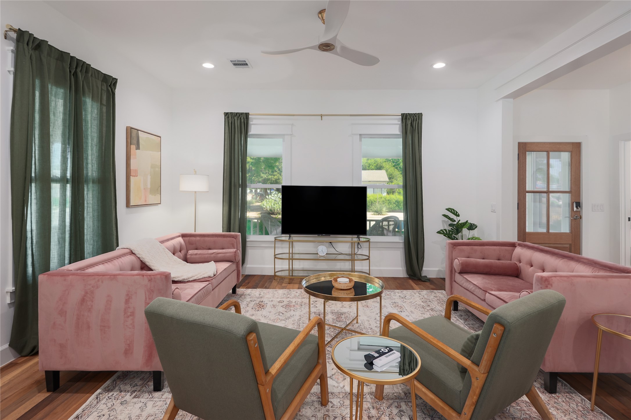 1701 Willow Street Austin, TX 78702 - Photo 12 of 29 a living room with furniture and a flat screen tv
