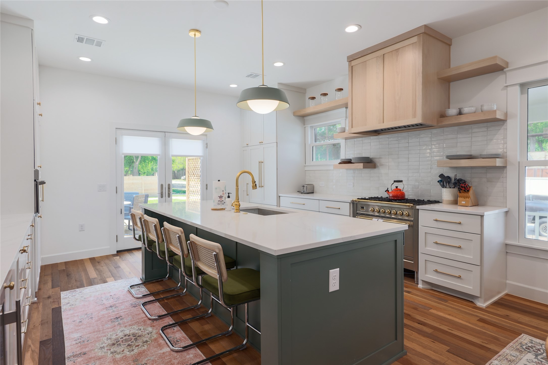 1701 Willow Street Austin, TX 78702 - Photo 15 of 29 a kitchen with wooden cabinets and center island