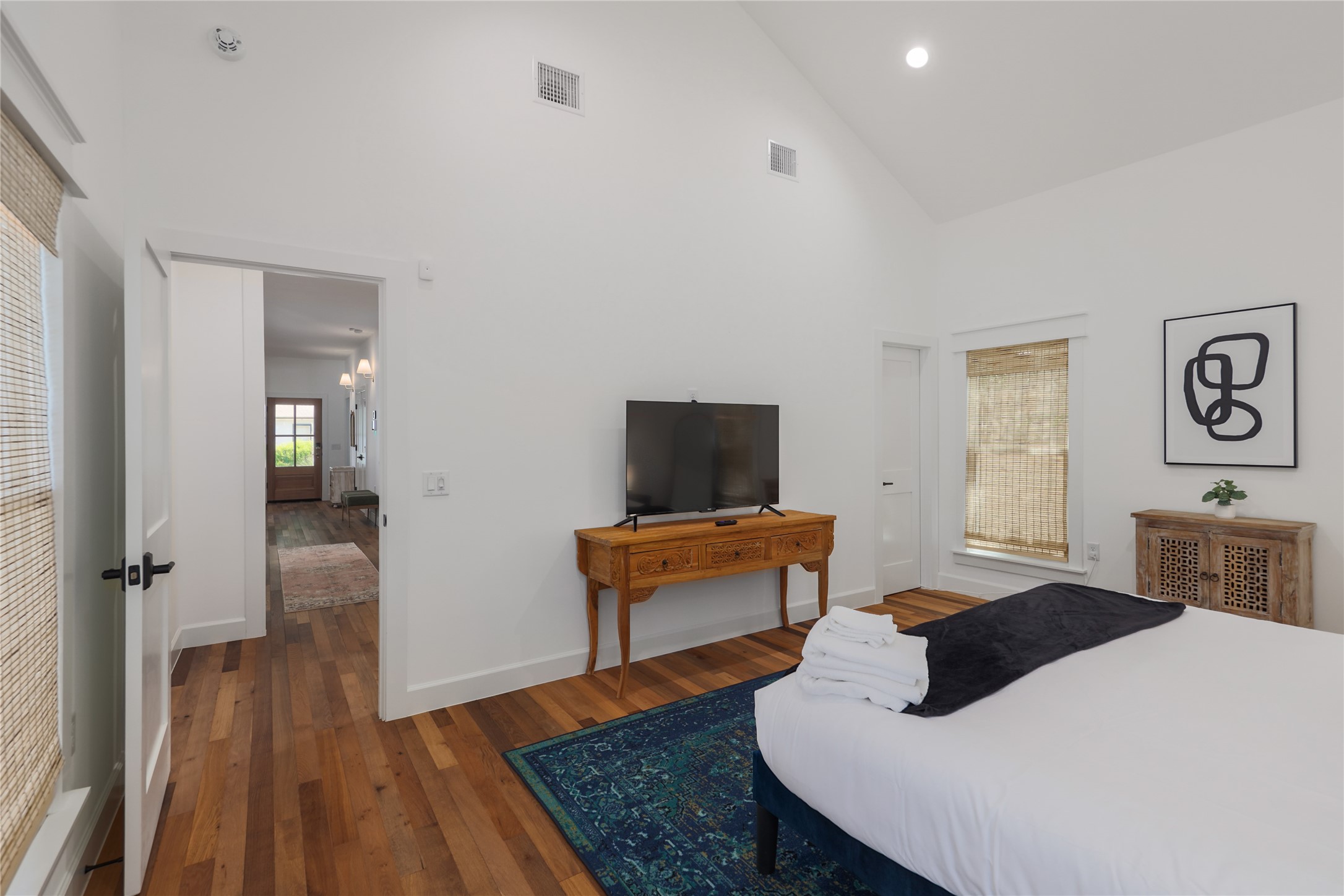 1701 Willow Street Austin, TX 78702 - Photo 21 of 29 a bedroom with a bed and wooden floor