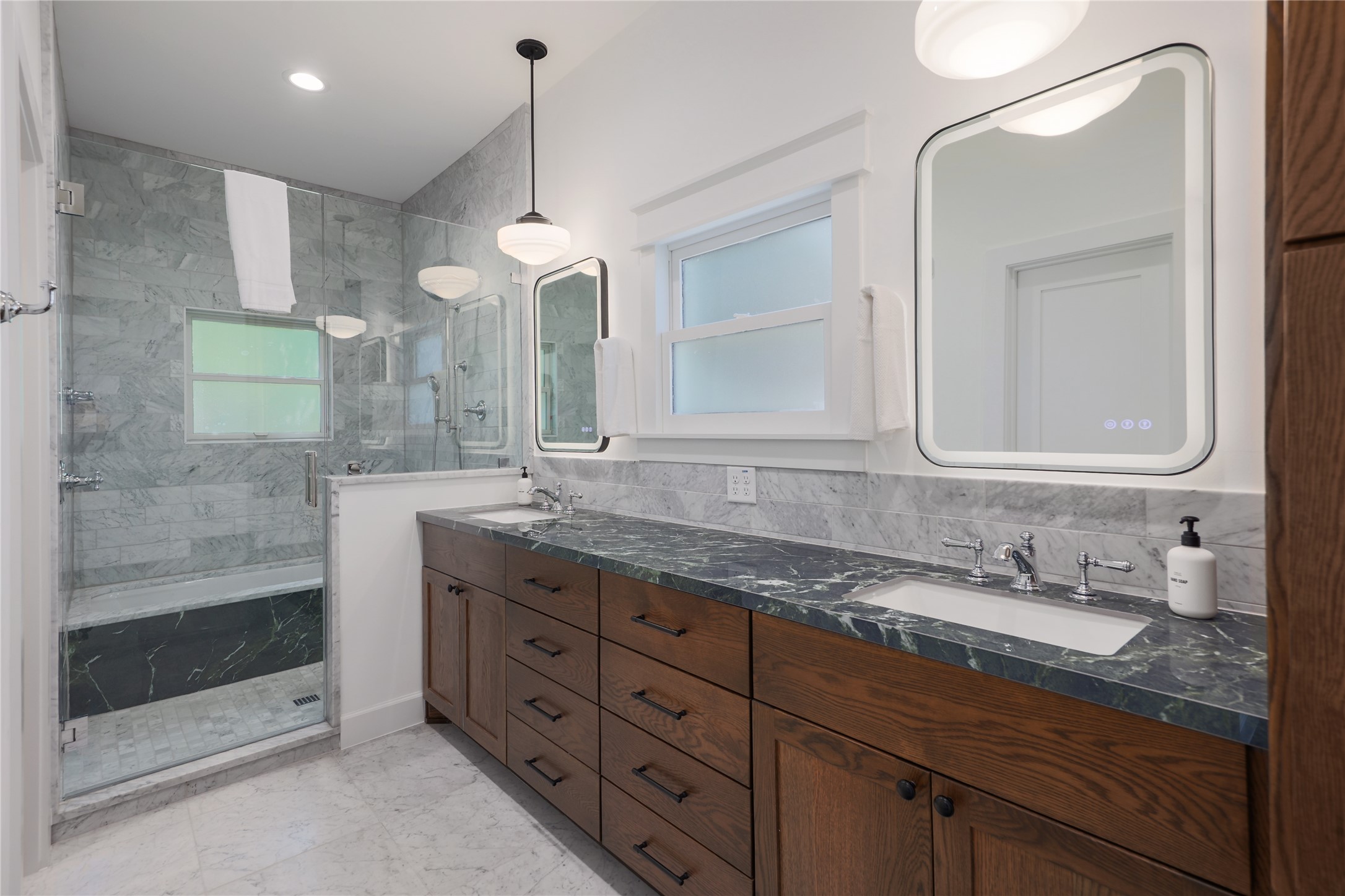 1701 Willow Street Austin, TX 78702 - Photo 22 of 29 a bathroom with double vanity and a mirror