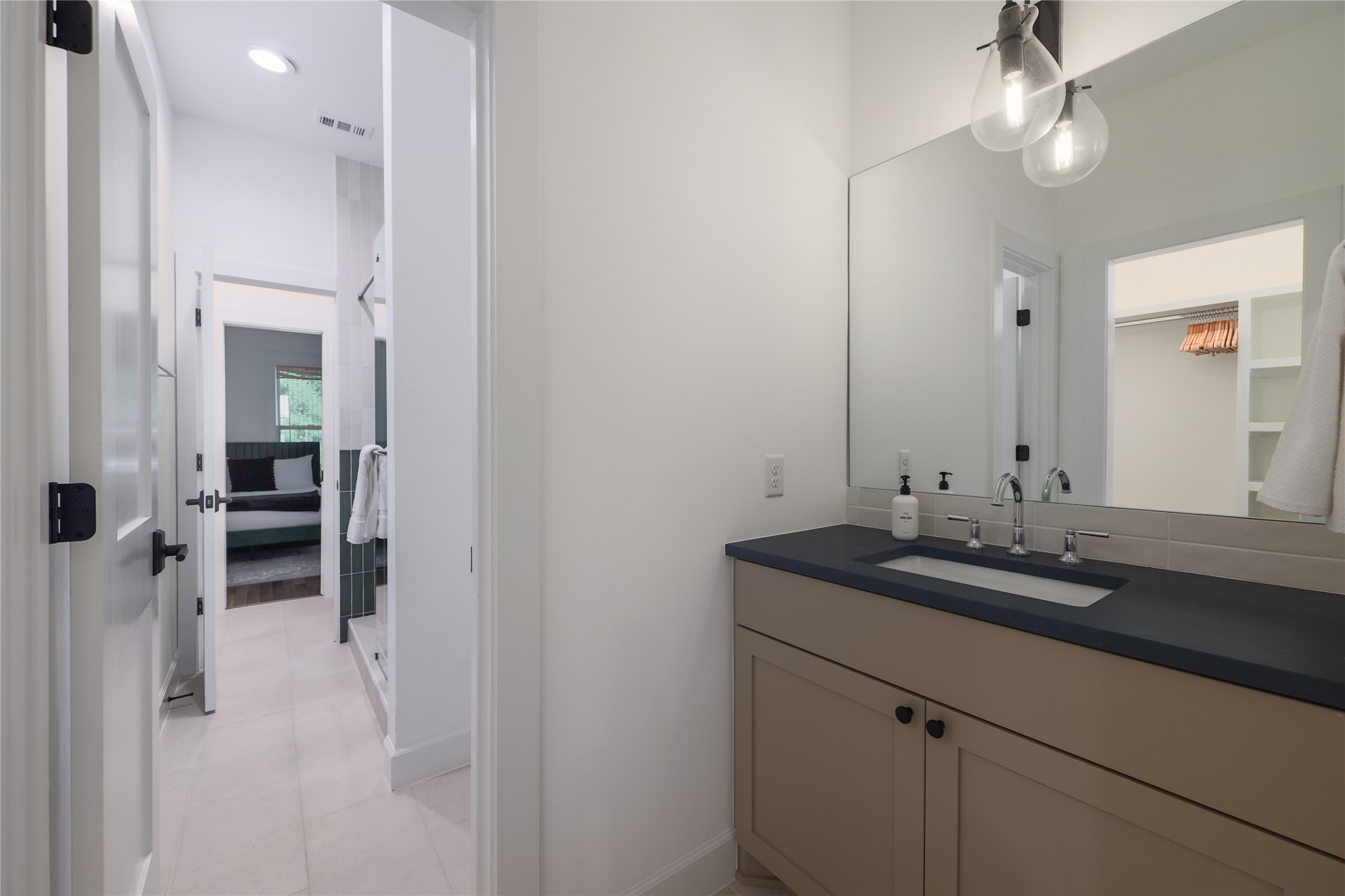 1701 Willow Street Austin, TX 78702 - Photo 25 of 29 a bathroom with a sink and a mirror