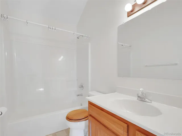 a bathroom with a sink vanity and a mirror