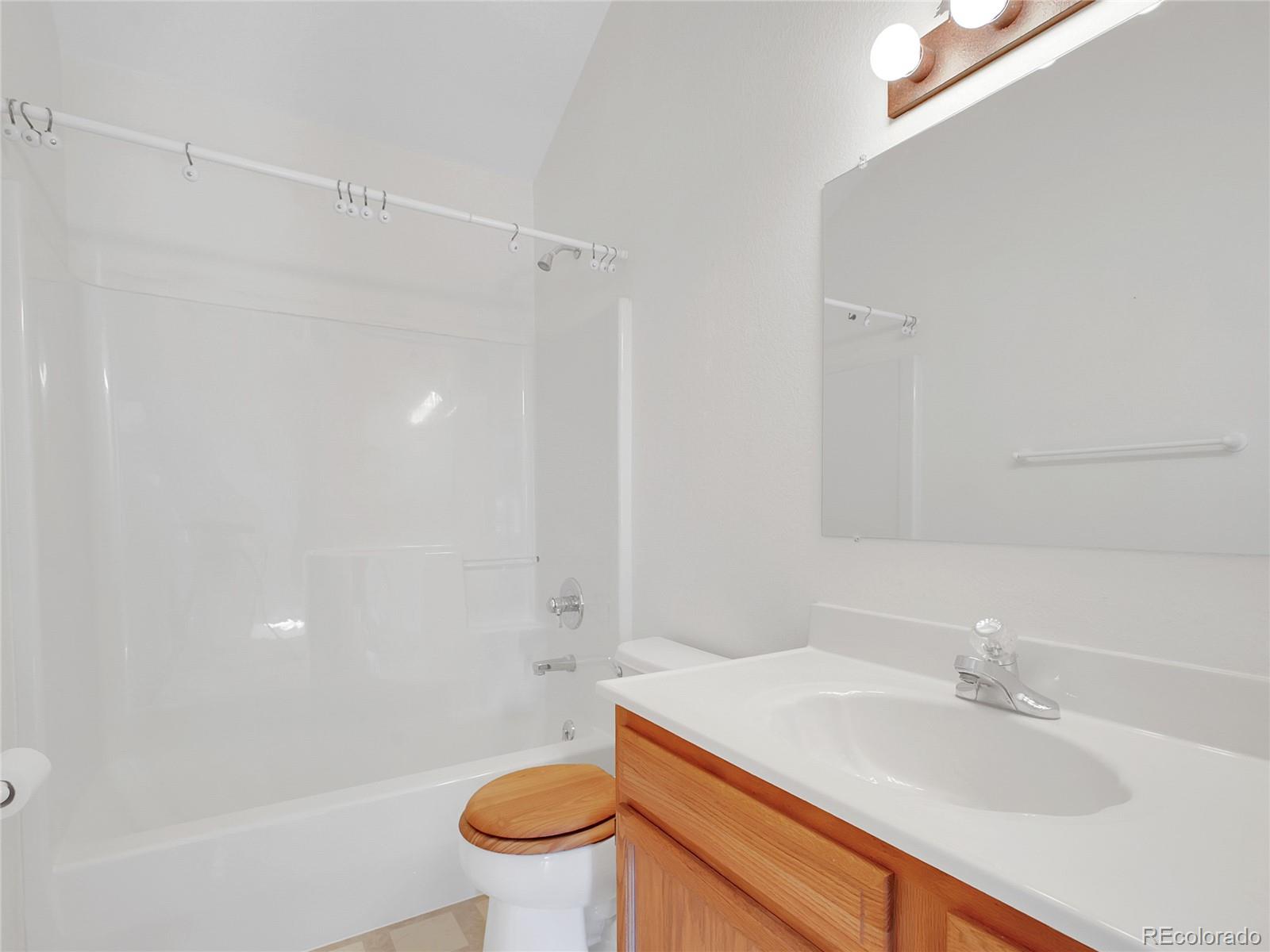 367 Moore Street Bailey, CO 80421 - Photo 14 of 32 a bathroom with a sink toilet and shower