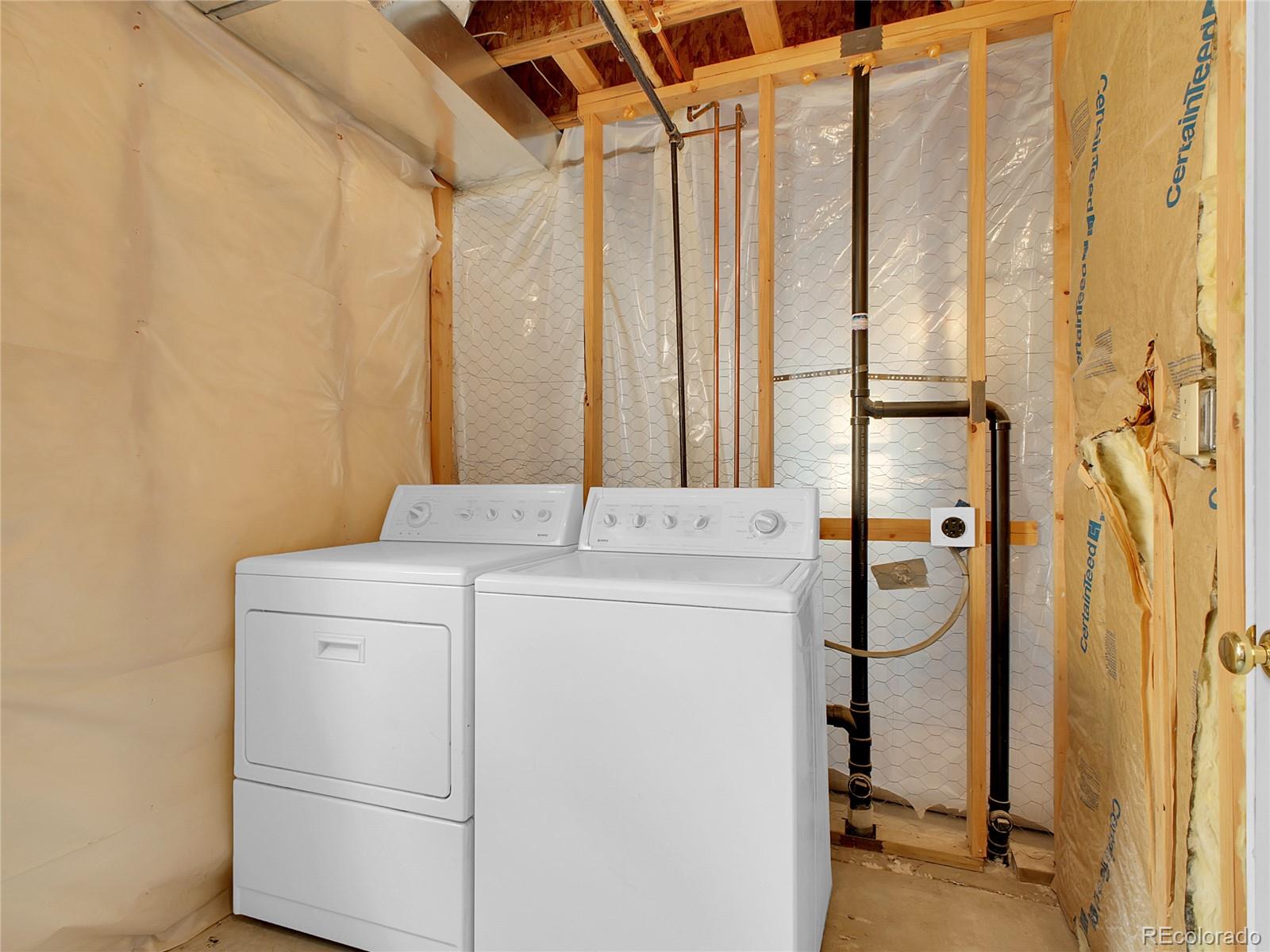 367 Moore Street Bailey, CO 80421 - Photo 22 of 32 a utility room with dryer and washer