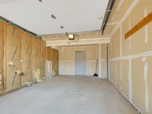 a view of a backyard of a house with a lake view