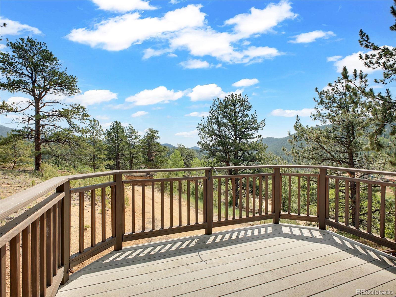 367 Moore Street Bailey, CO 80421 - Photo 25 of 32 a view of balcony and wooden floor