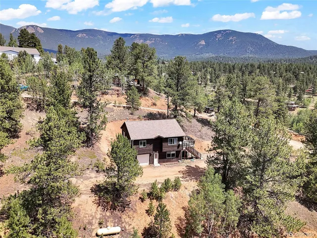 a view of a city with mountains in the background