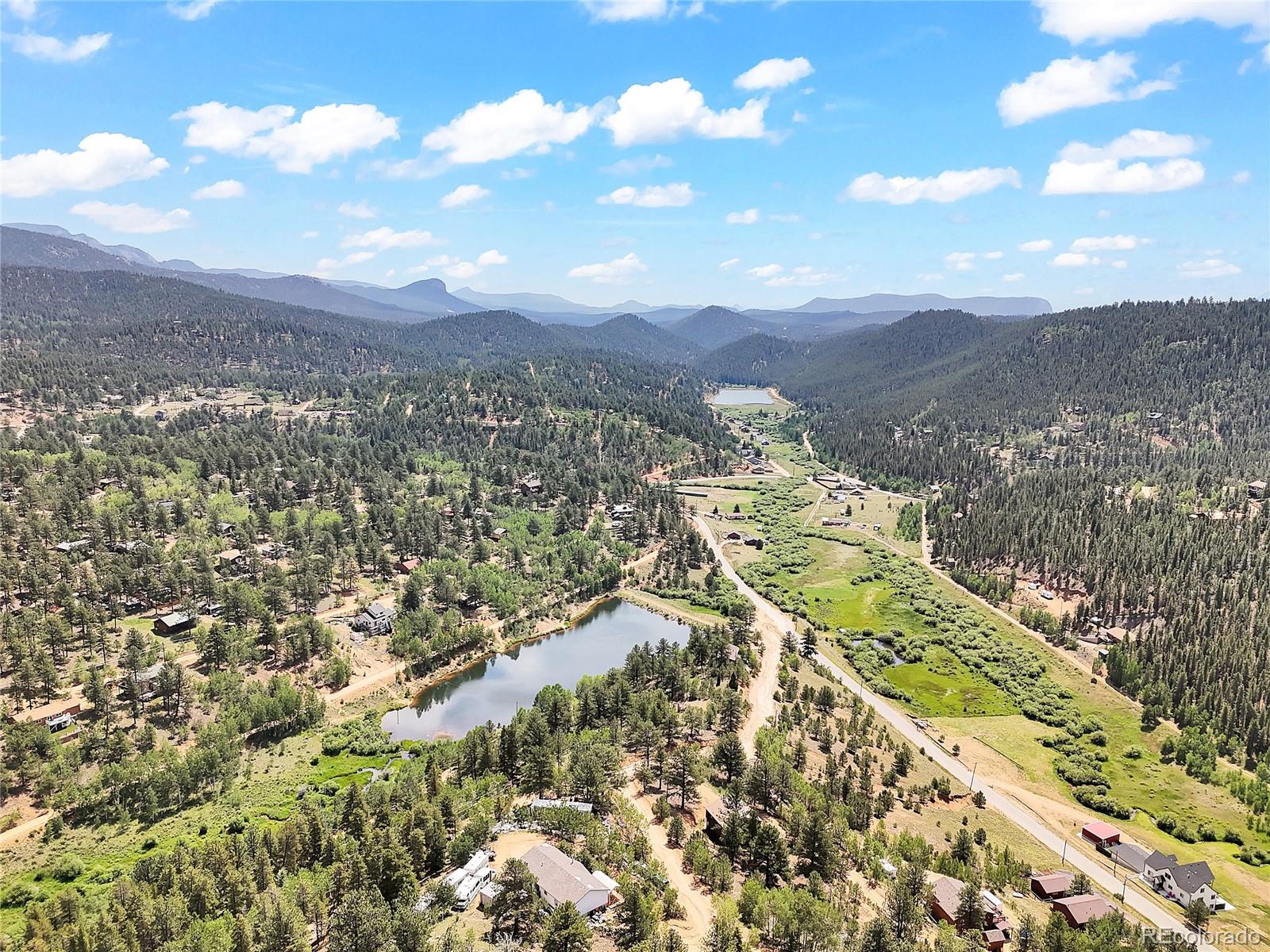 367 Moore Street Bailey, CO 80421 - Photo 30 of 32 a view of a city with mountains in the background