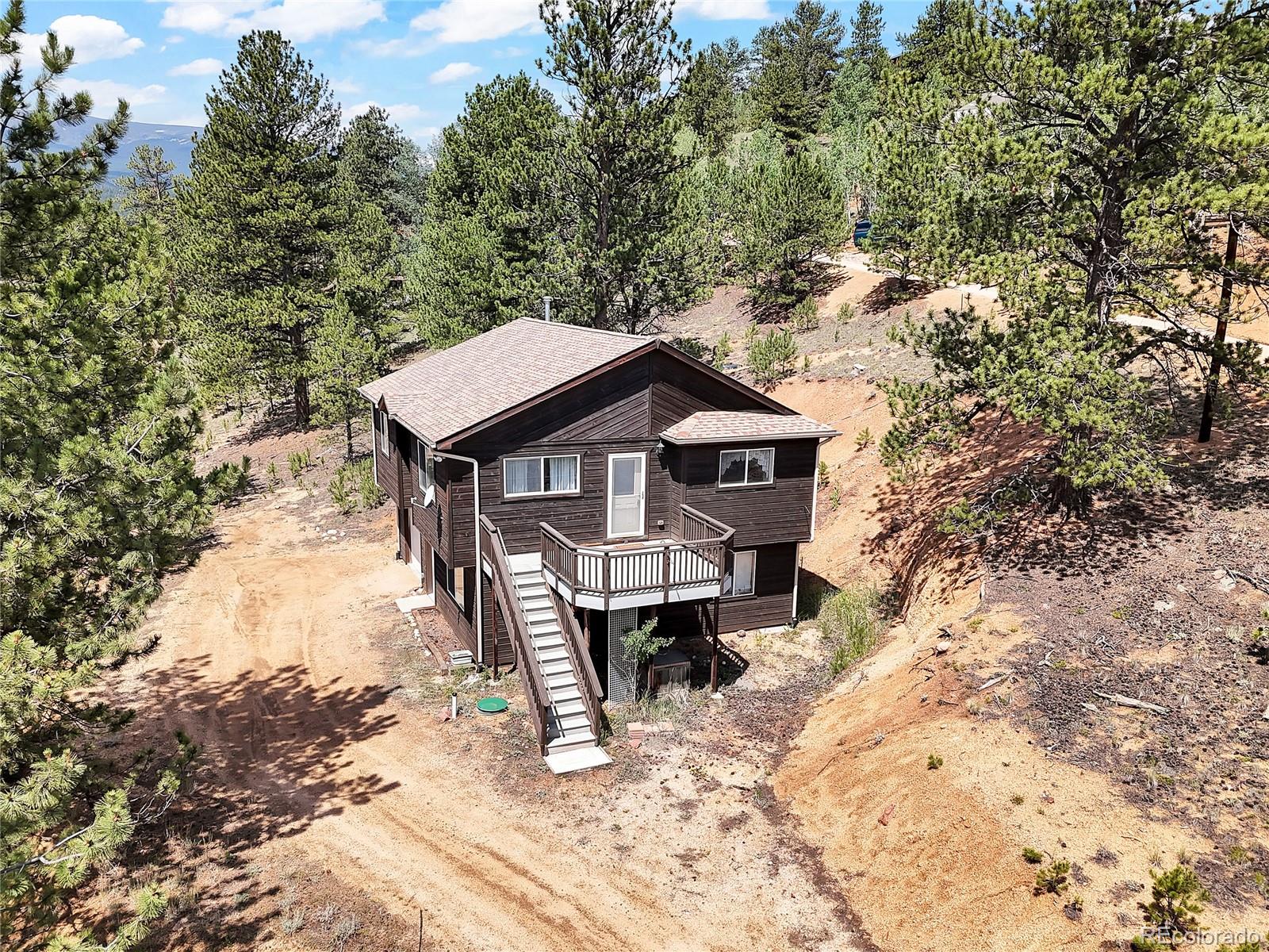 367 Moore Street Bailey, CO 80421 - Photo 3 of 32 a house view with a outdoor space
