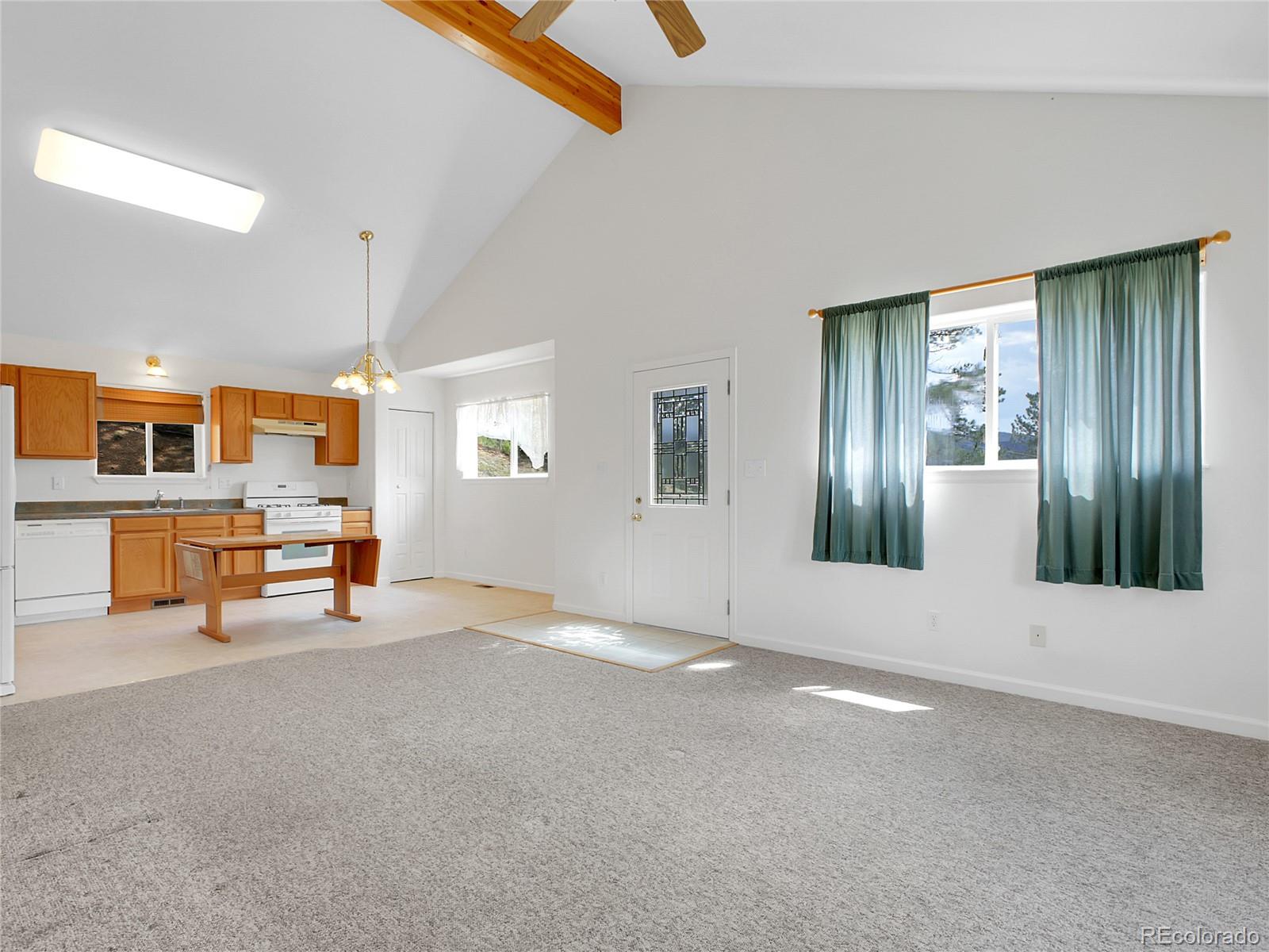 367 Moore Street Bailey, CO 80421 - Photo 6 of 32 a view of an empty room with a window