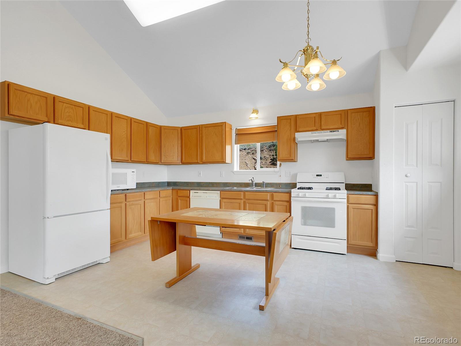 367 Moore Street Bailey, CO 80421 - Photo 9 of 32 a view of kitchen with cabinets and stainless steel appliances