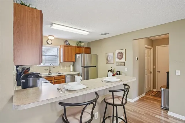 a kitchen with a table and chairs in it