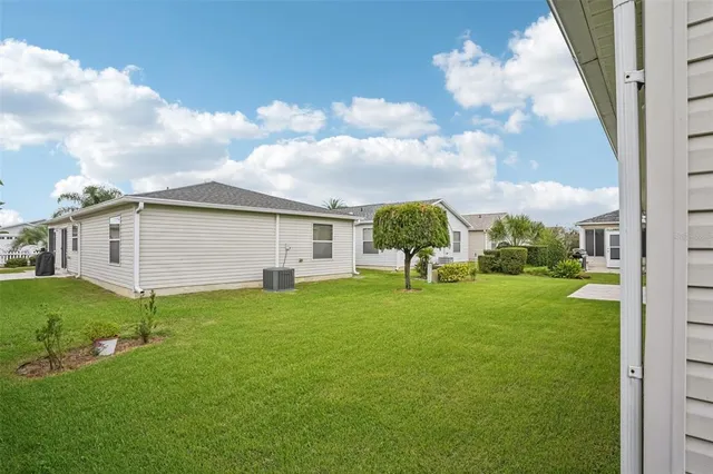 an aerial view of a house having yard