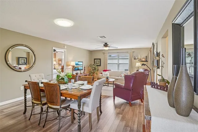 a view of a dining room with furniture window and wooden floor