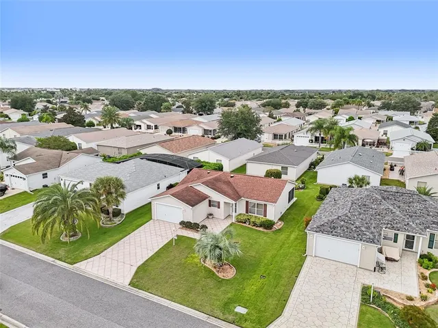 an aerial view of a house with a garden