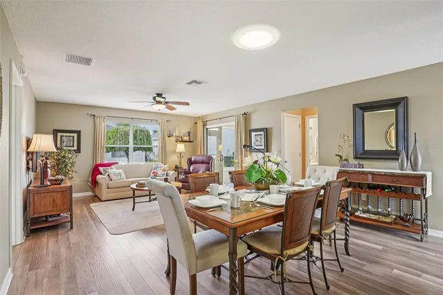 a view of a livingroom with furniture window and wooden floor