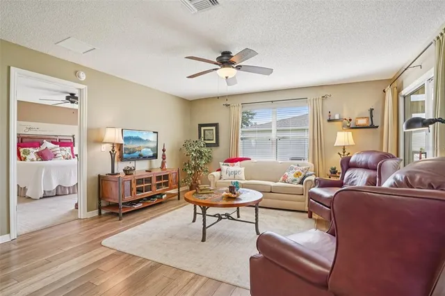 a living room with furniture and a table