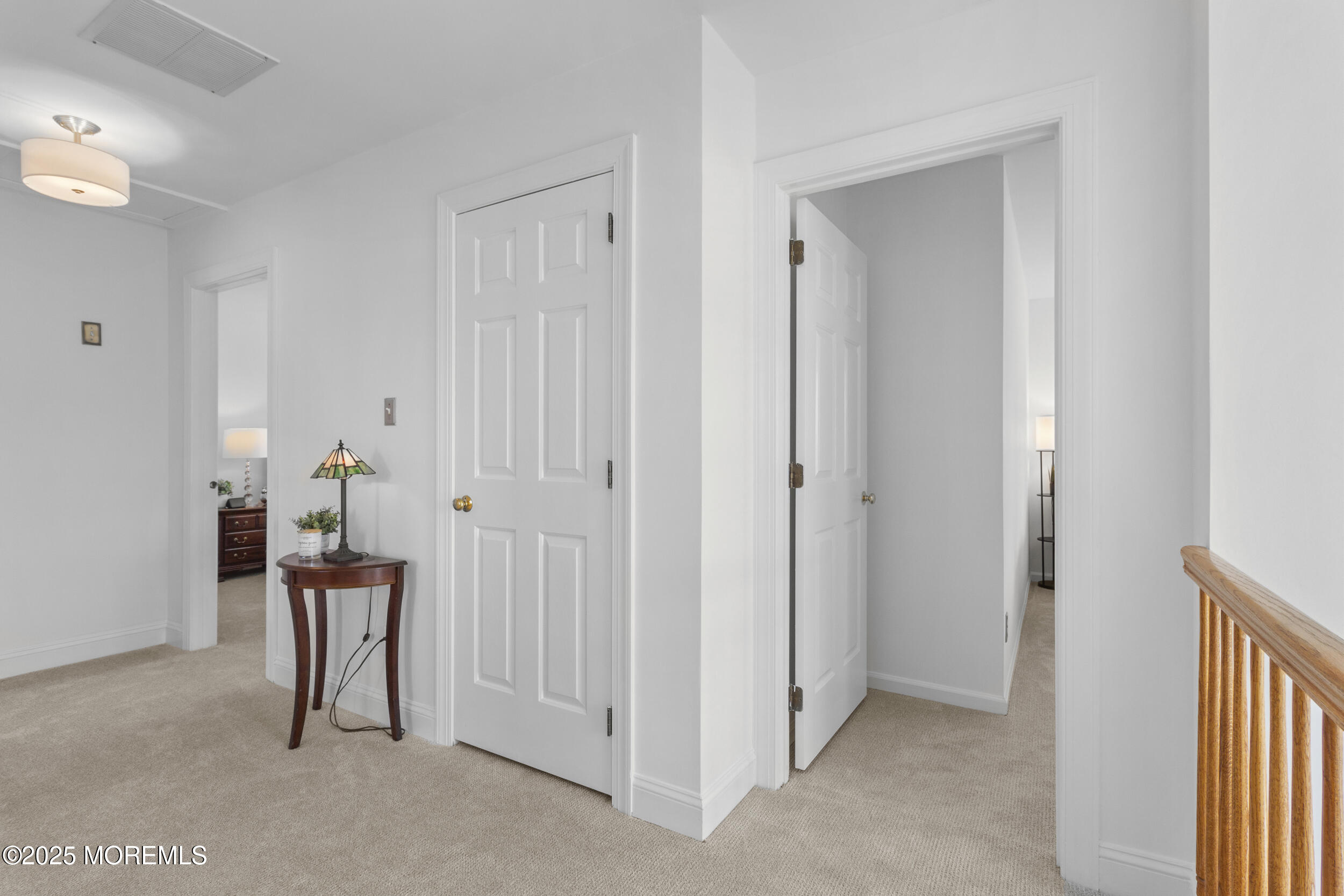 27 Danella Way Howell, NJ 07731 - Photo 11 of 25 a view of a hallway with seating area