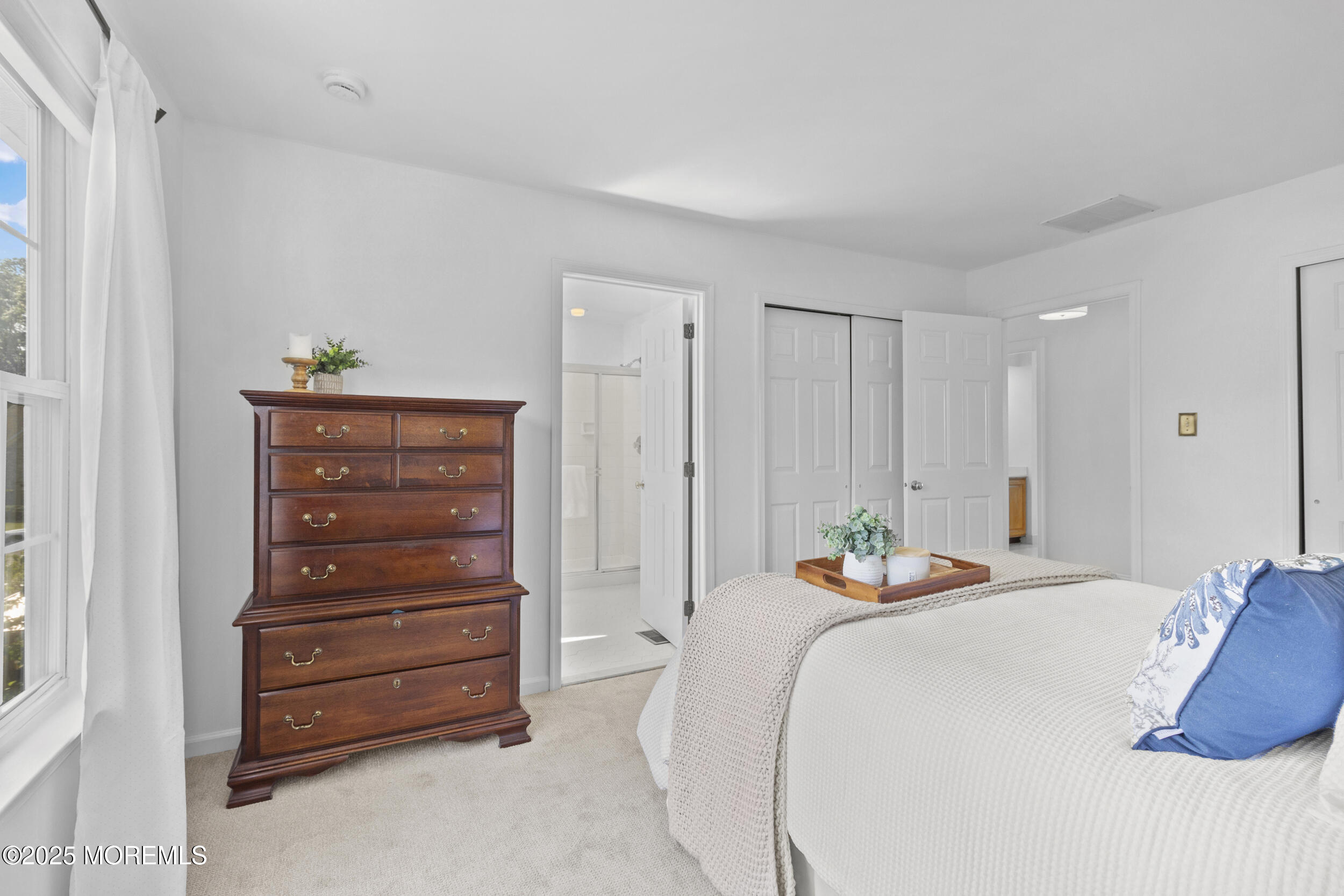 27 Danella Way Howell, NJ 07731 - Photo 13 of 25 a bedroom with a bed and a dresser