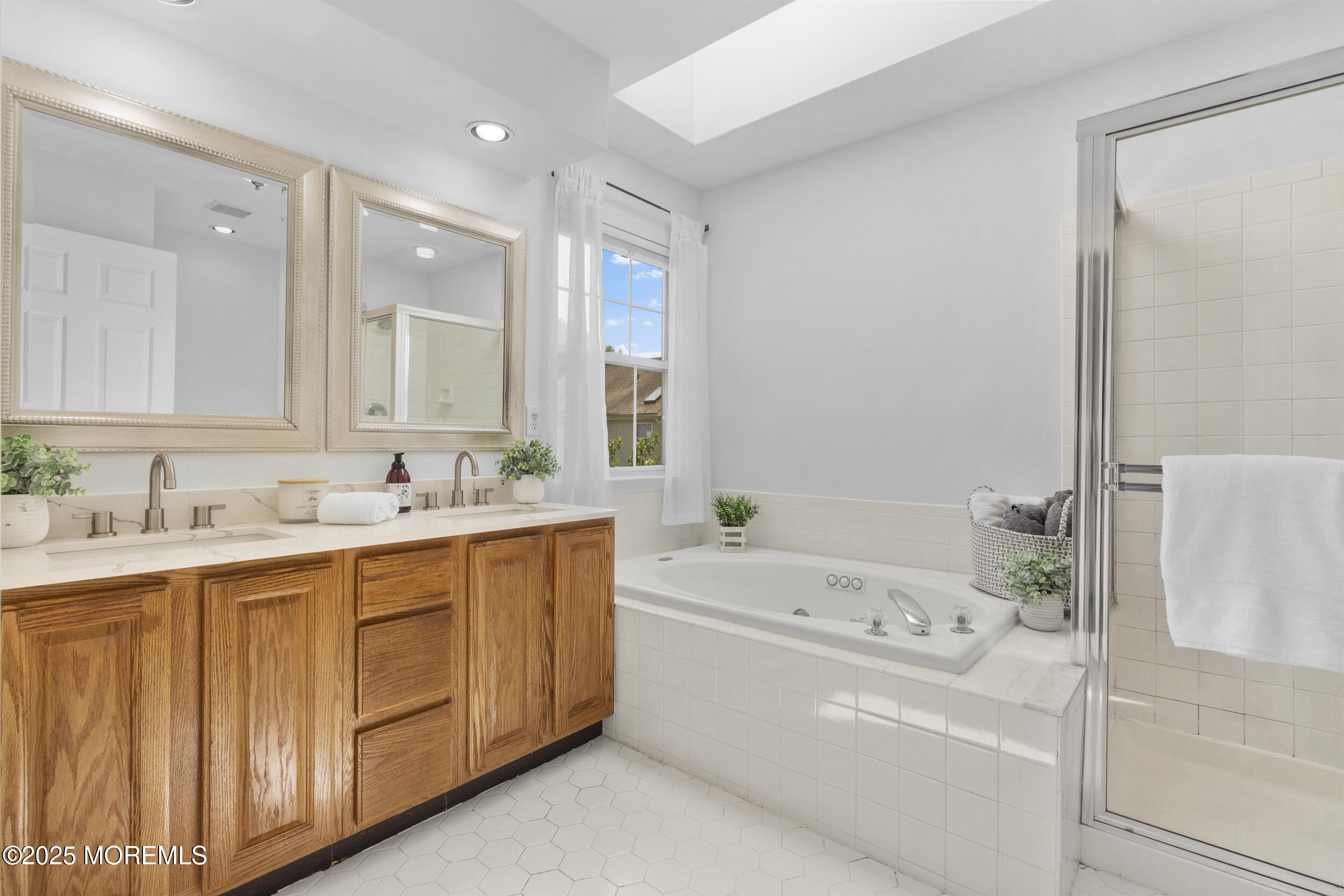 27 Danella Way Howell, NJ 07731 - Photo 14 of 25 a bathroom with a tub sink and mirror