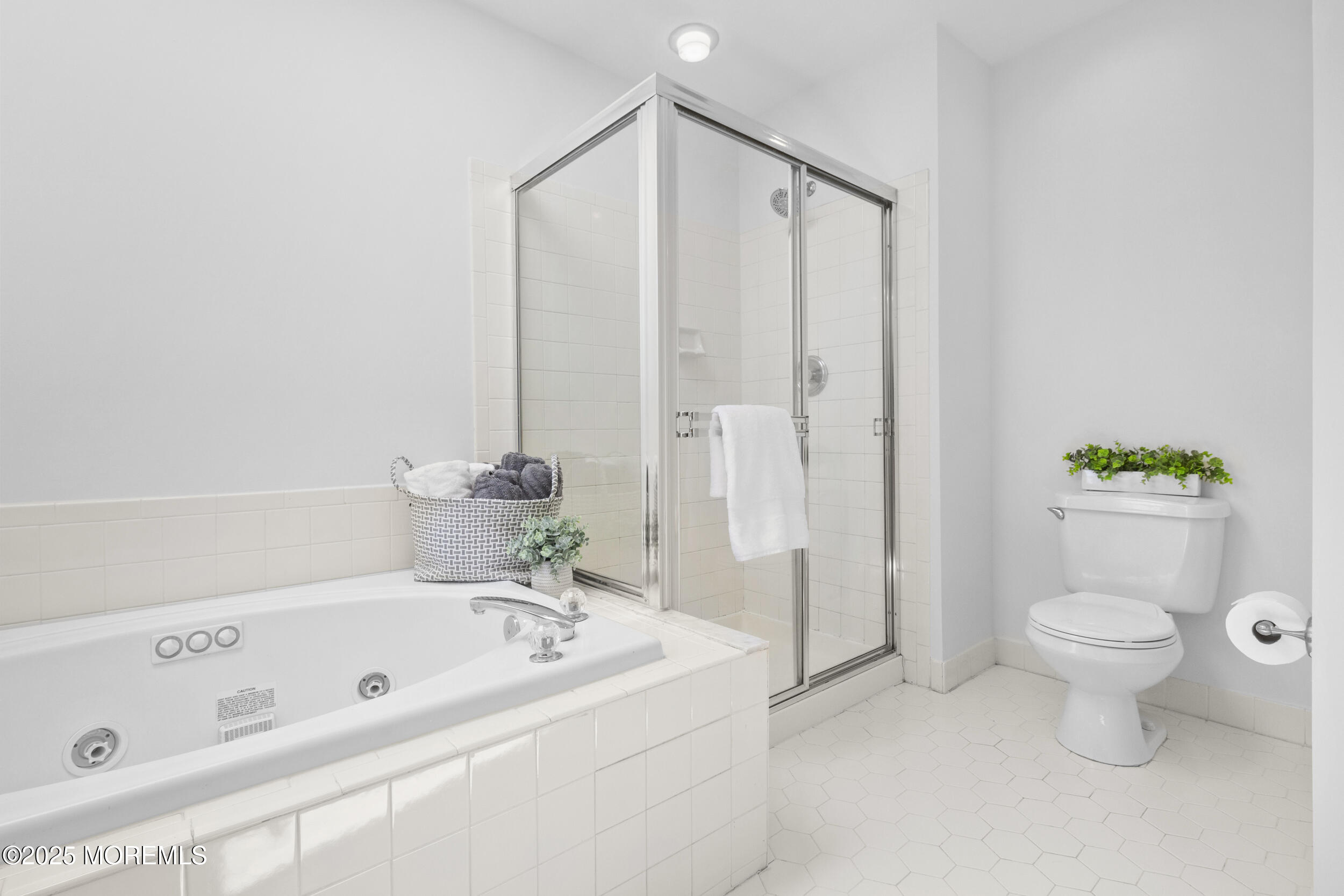 27 Danella Way Howell, NJ 07731 - Photo 15 of 25 a bathroom with a bathtub a toilet and a shower